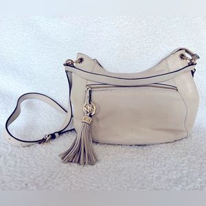 Michael Kors cream leather Crossbody with tassel. In good condition.